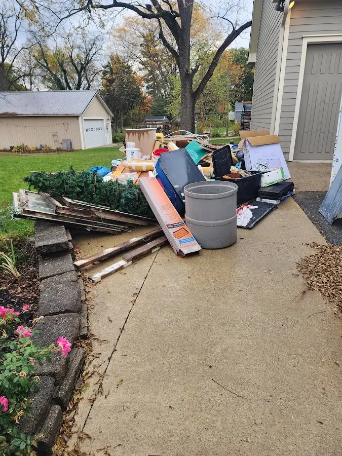 Dumpster being loaded with debris for 3 Yard Dumpster Rental in Rock Hill